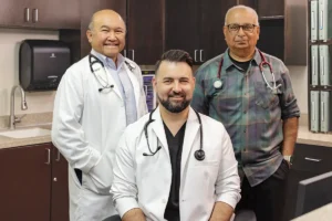 Three doctors standing together at Oak River