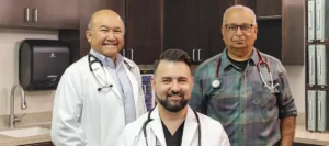 Three doctors standing together at Oak River