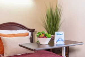 A residents bedside with some food at Oak River